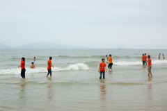 Kinds playing in the water in Cua Dai Beach