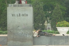 Homeless man by the statue of Stalin