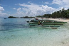 Guimbitayan.fisherman.on_.boat_.northern.beach_